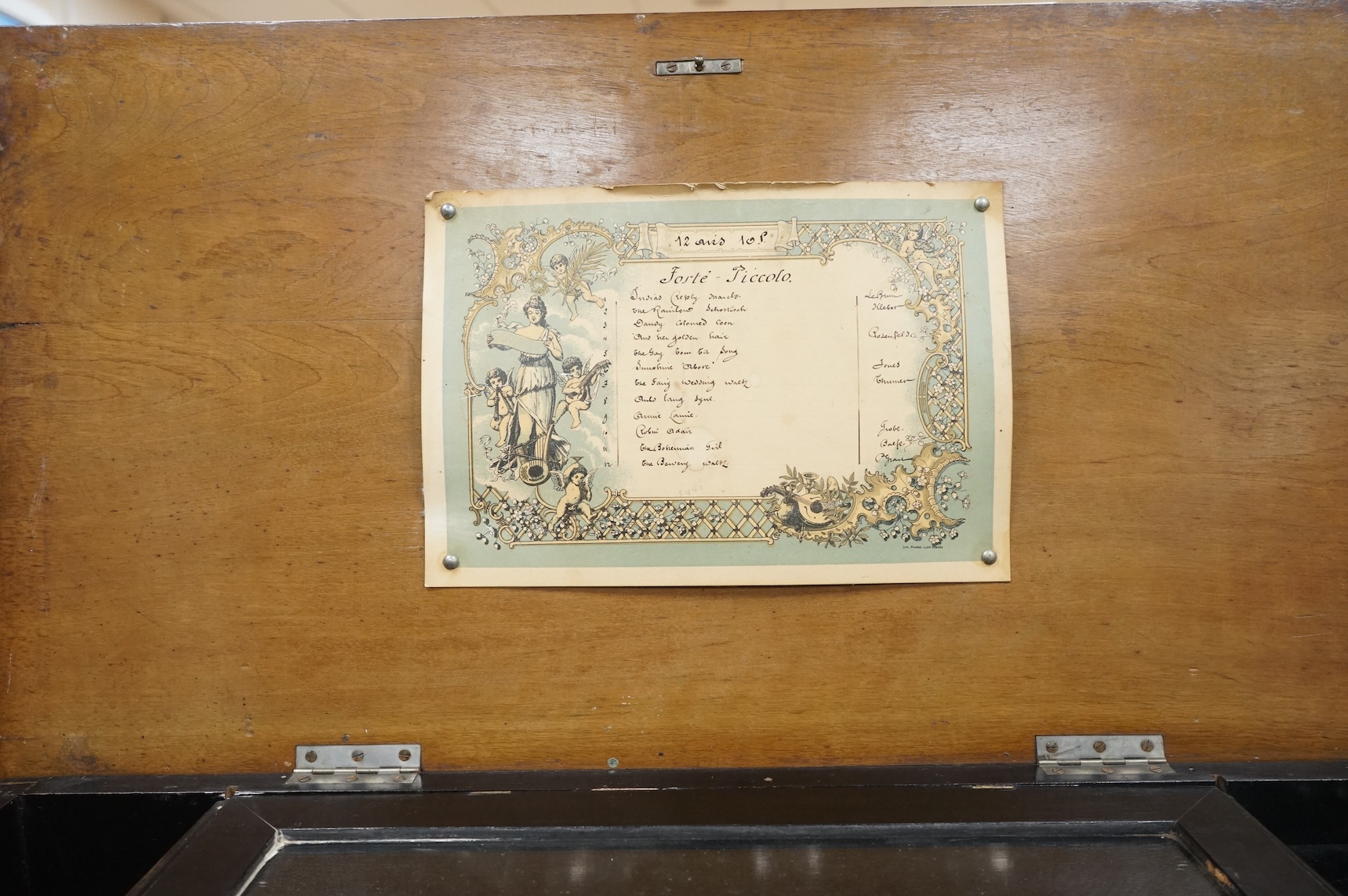 A late 19th century Swiss music box in a rosewood and ebonised case, playing twelve airs on a 52 tooth comb, five bells and a drum, 60cm wide, 27cm high, 32.5cm deep.